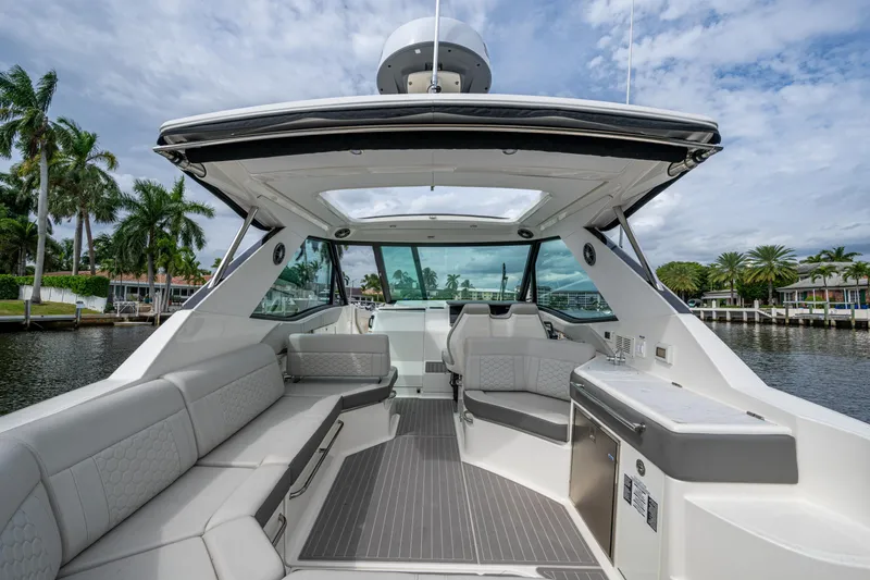 Slide: The Image of 2023 Sea Ray Sundancer 320 Outboard interior with luxurious seating and modern amenities. - 54