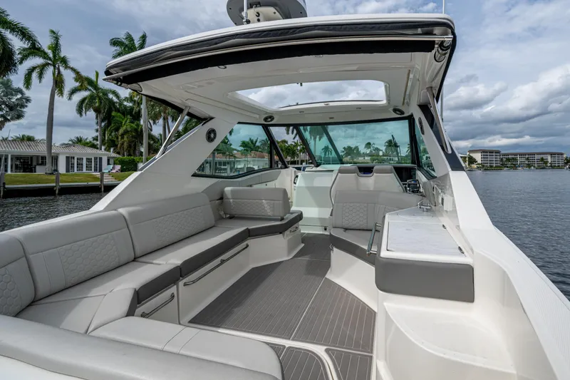 Slide: The Image of Luxurious 2023 Sea Ray Sundancer 320 Outboard boat interior with spacious seating and modern design. - 55