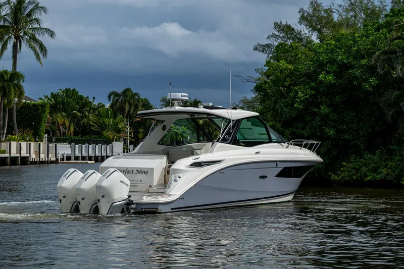 Slide: The Image of 2023 Sea Ray Sundancer 320 Outboard cruising on a scenic waterway. - 62