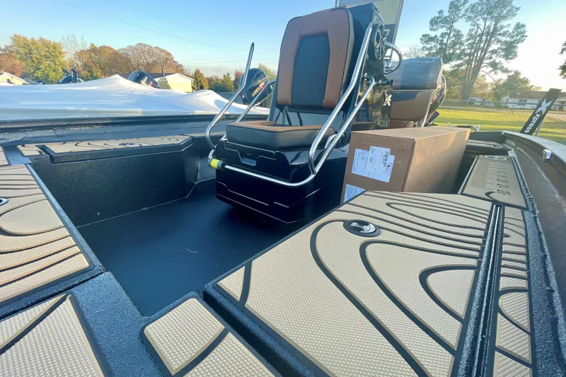 Slide: The Image of 2026 Xpress H20B Bay boat interior with seating and storage compartments. - 3