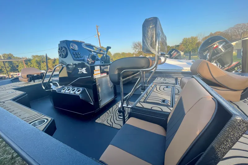 Slide: The Image of 2026 Xpress H20B Bay boat interior with modern console and seating. - 4