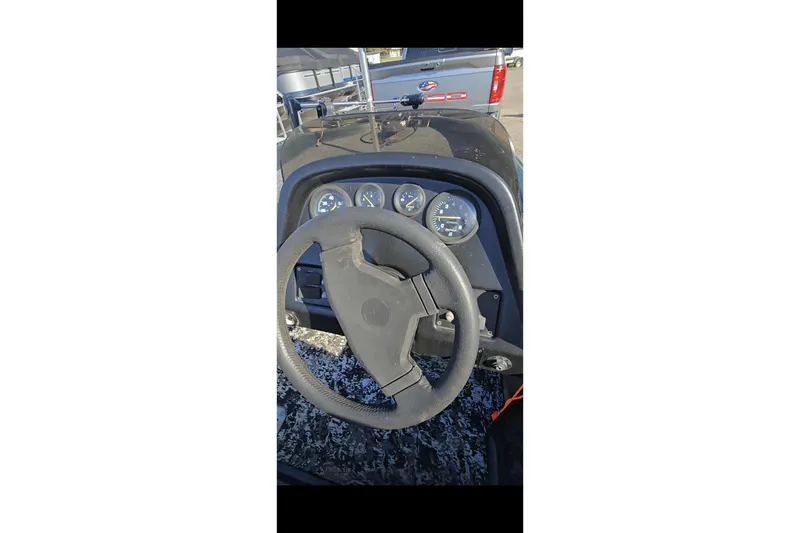 Slide: The Image of Steering wheel and dashboard of a 1995 Nitro 170 TF boat. - 10