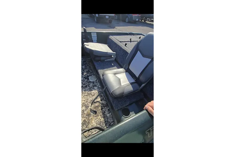 Slide: The Image of Interior of a 1995 Nitro 170 TF boat with gray seating and carpeted flooring. - 5