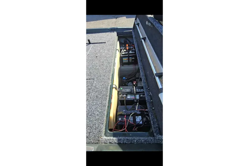 Slide: The Image of 1995 Nitro 170 TF boat battery compartment with wiring and components. - 6