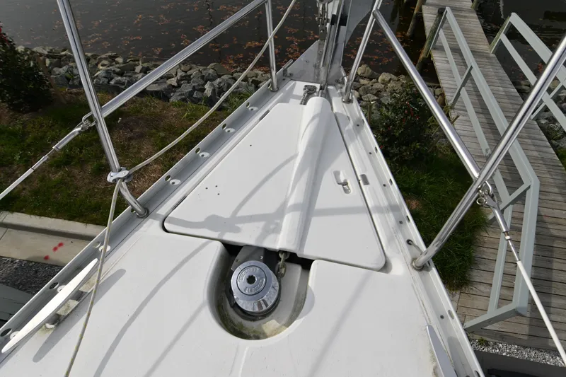 Slide: The Image of 2001 Beneteau 361 sailboat in marina, surrounded by other boats and equipment. - 12