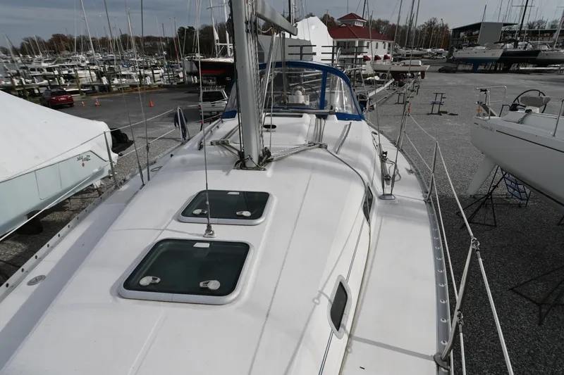 Slide: The Image of View from inside a 2001 Beneteau 361 yacht, overlooking a marina with boats. - 13