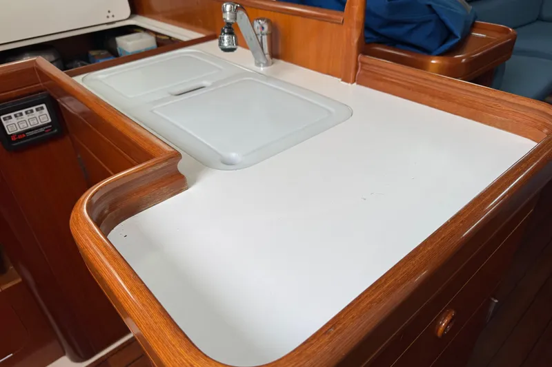 Slide: The Image of Bow of 2001 Beneteau Oceanis Clipper 361 sailboat with anchor winch and railing. - 18