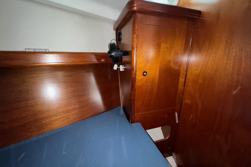 Slide: The Image of 2001 Beneteau Oceanis Clipper 361 yacht kitchen with sink, stove, and microwave. - 32