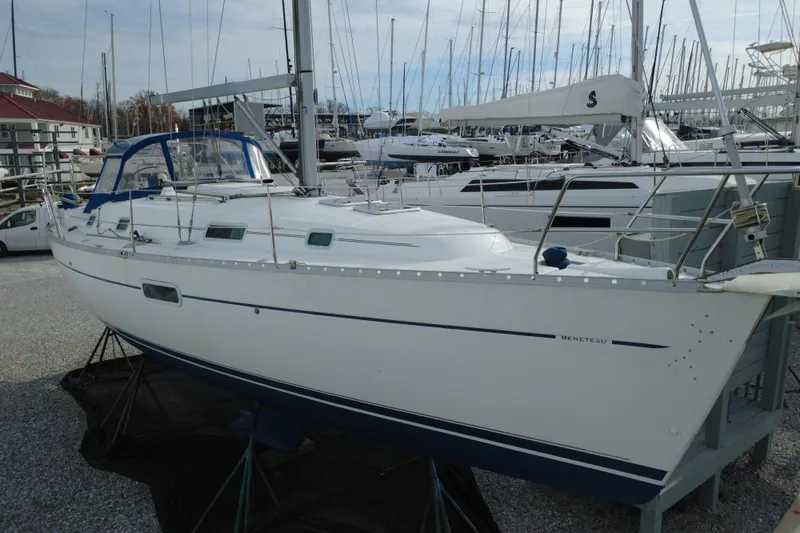 Slide: The Image of 2001 Beneteau Oceanis Clipper 361 sailboat docked in a marina. - 9