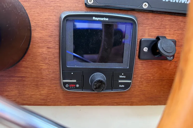 Slide: The Image of Raymarine control panel on 2008 Ranger Tugs R-25 boat dashboard. - 10