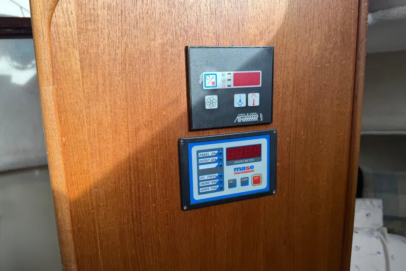 Slide: The Image of Control panel on 2008 Ranger Tugs R-25 boat, featuring digital displays and buttons. - 11