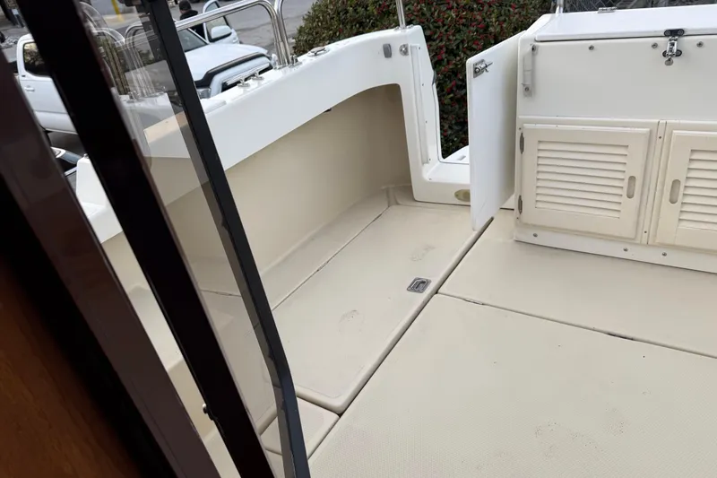 Slide: The Image of 2008 Ranger Tugs R-25 boat deck with open storage compartments. - 16