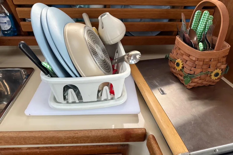 Slide: The Image of Dishes and utensils drying on a Ranger Tugs R-25 boat kitchen counter, 2008 model. - 25