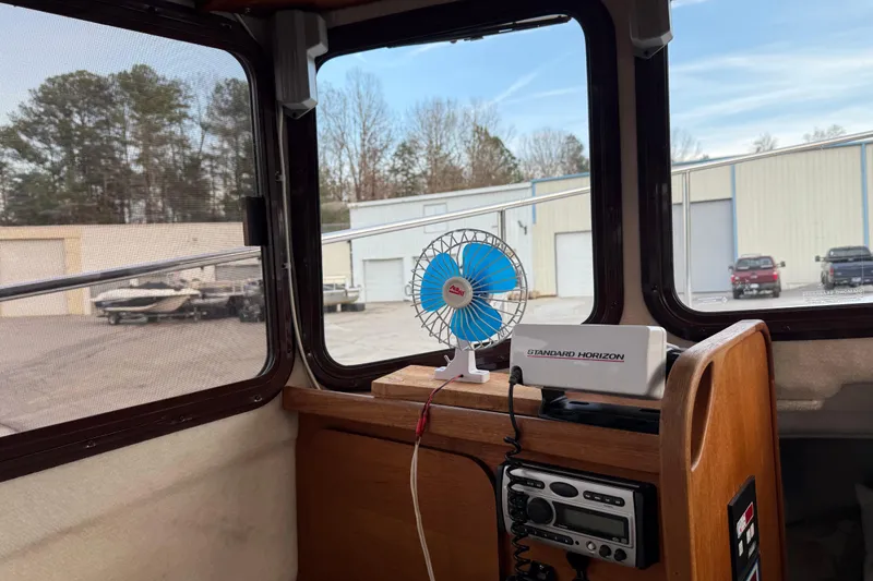 Slide: The Image of Interior of 2008 Ranger Tugs R-25 with fan and radio equipment. - 34