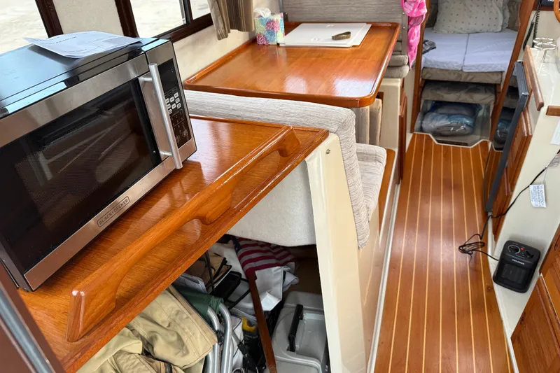 Slide: The Image of Interior of 2008 Ranger Tugs R-25 with microwave and wooden flooring. - 41