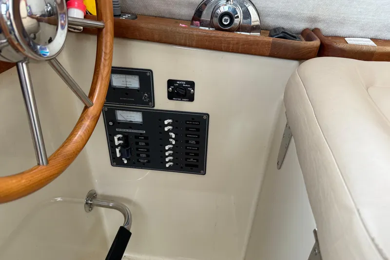 Slide: The Image of Control panel and steering wheel of a 2008 Ranger Tugs R-25 boat interior. - 7