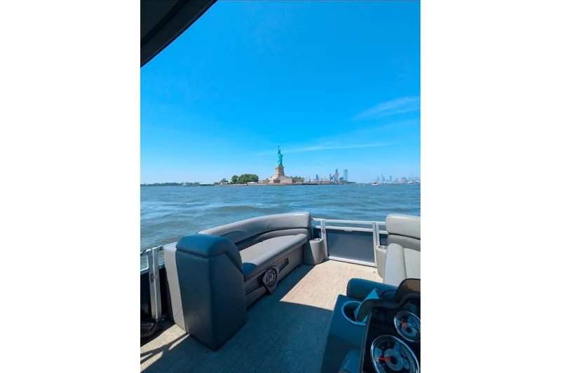 Slide: The Image of Dashboard of 2021 Avalon Catalina Quad Lounger boat with Garmin navigation system. - 8