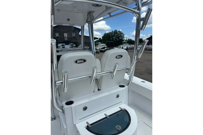 Slide: The Image of 2022 Onslow Bay 27 boat interior with rod holders and seating. - 4
