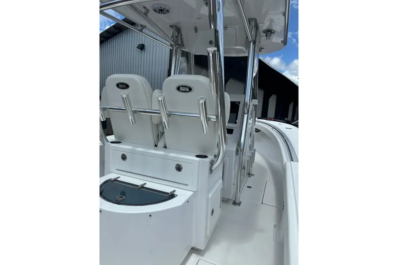 Slide: The Image of 2022 Onslow Bay 27 boat interior with seating and storage compartments. - 6