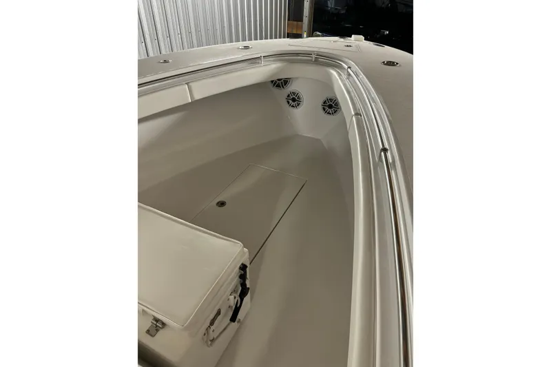 Slide: The Image of 2022 Onslow Bay 27 boat interior with storage and speakers. - 8