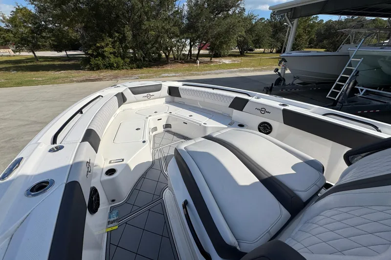 Slide: The Image of 2025 Fountain 32 NX boat interior with spacious seating and modern design. - 17