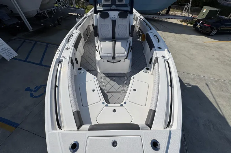Slide: The Image of 2025 Fountain 32 NX boat interior with sleek seating and modern design. - 18