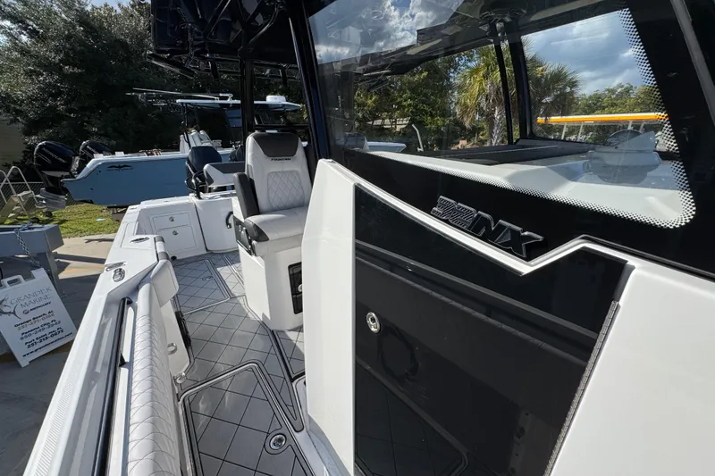 Slide: The Image of 2025 Fountain 32 NX boat interior with sleek seating and modern design. - 23