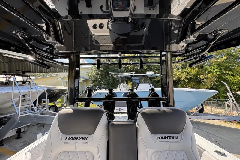 Slide: The Image of 2025 Fountain 32 NX boat interior with sleek design and comfortable seating. - 26