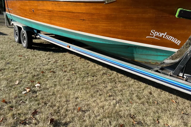 Slide: The Image of 1938 Chris-Craft 28 Sportsman boat on trailer, showcasing wooden hull and vintage design. - 11