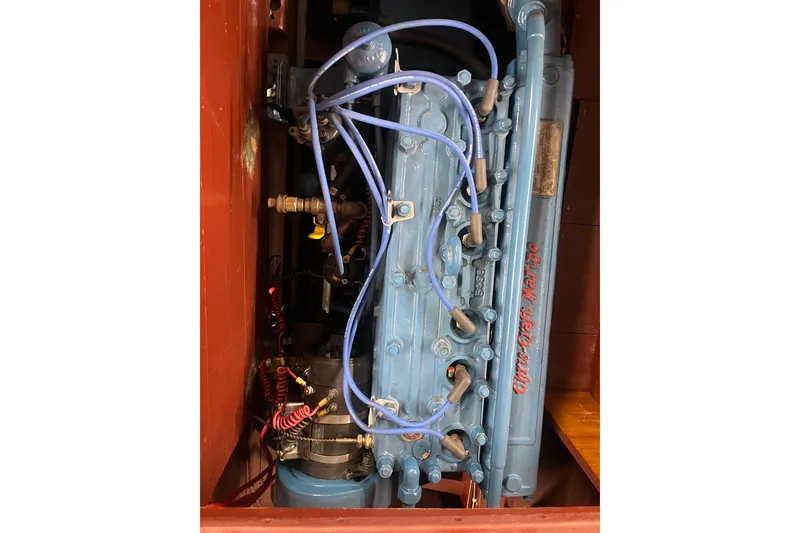 Slide: The Image of 1938 Chris-Craft 28 Sportsman engine with blue wiring and components. - 17