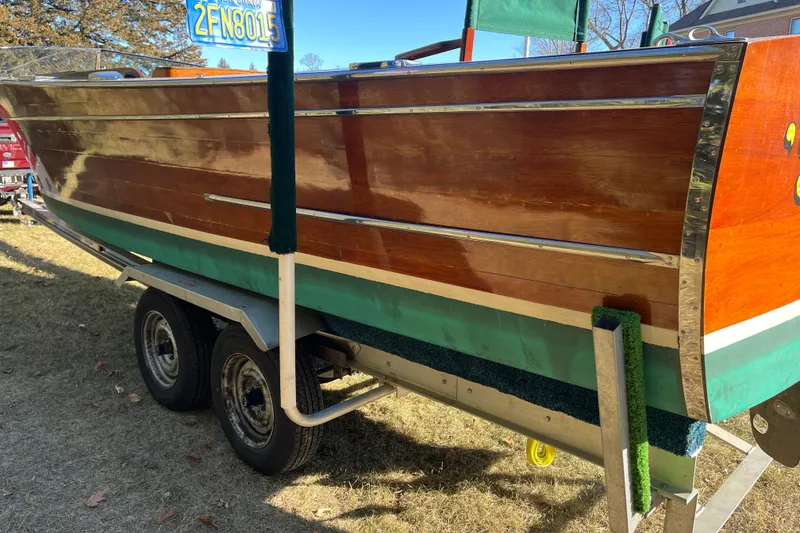 Slide: The Image of 1938 Chris-Craft 28 Sportsman wooden boat on trailer, showcasing classic design. - 9