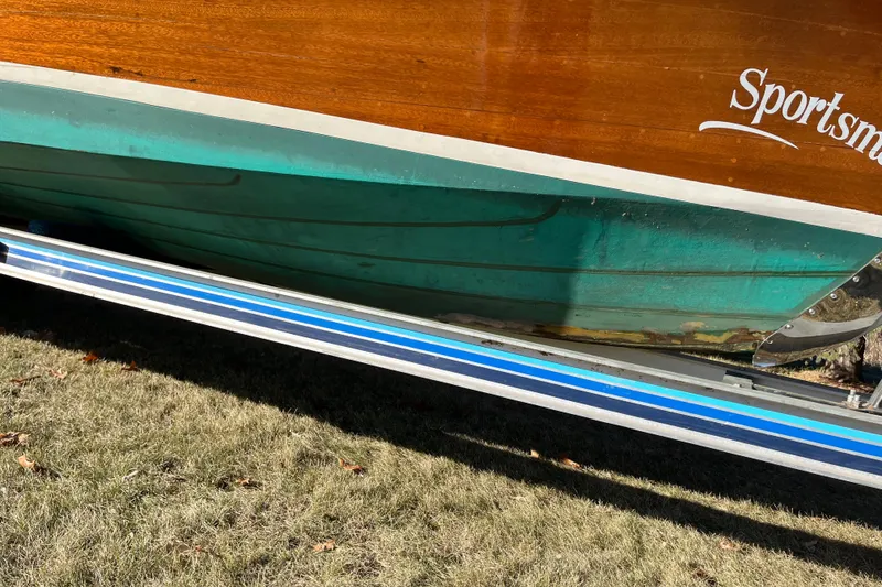 Slide: The Image of 1938 Chris-Craft 28 Sportsman boat on trailer, showcasing wooden hull and vintage design. - 12