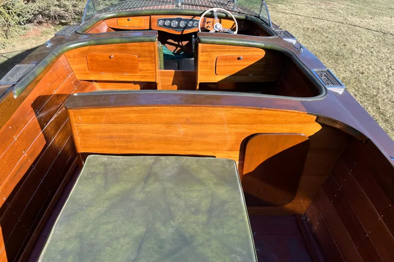 Slide: The Image of 1938 Chris-Craft 28 Sportsman boat interior with polished wood and vintage dashboard. - 15