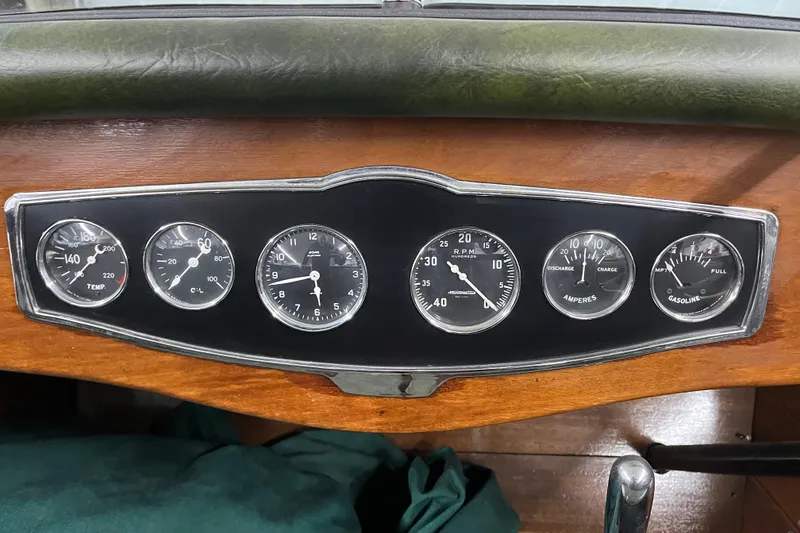 Slide: The Image of Dashboard of a 1938 Chris-Craft 28 Sportsman boat with vintage gauges. - 19
