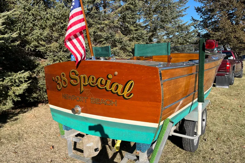 Slide: The Image of Vintage 1938 Chris-Craft 28 Sportsman boat with American flag, Newport Beach lettering. - 4