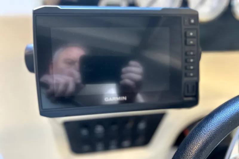 Slide: The Image of Garmin display on 2019 Regal 2800 Bowrider dashboard, steering wheel visible. - 12