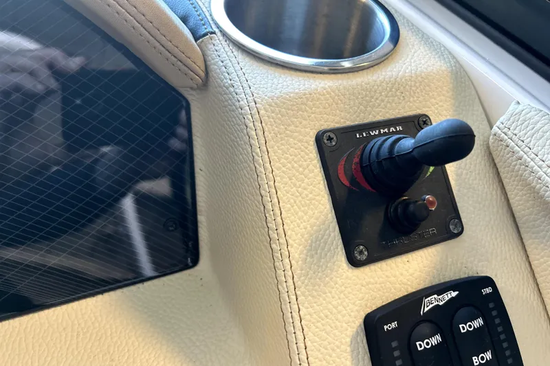 Slide: The Image of Control panel of 2019 Regal 2800 Bowrider boat featuring Lewmar thruster joystick. - 13