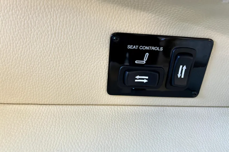 Slide: The Image of Seat controls on 2019 Regal 2800 Bowrider, featuring adjustable buttons on beige leather. - 15
