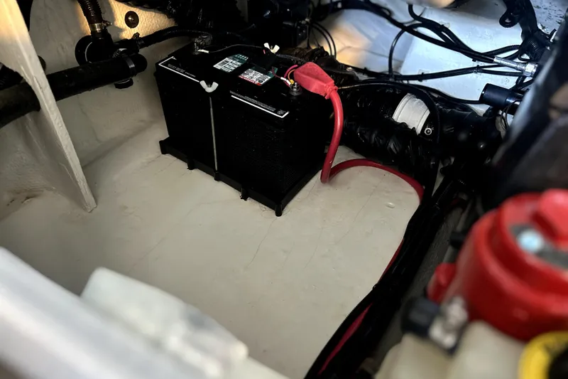 Slide: The Image of Battery compartment of 2019 Regal 2800 Bowrider boat with wiring and connections. - 29