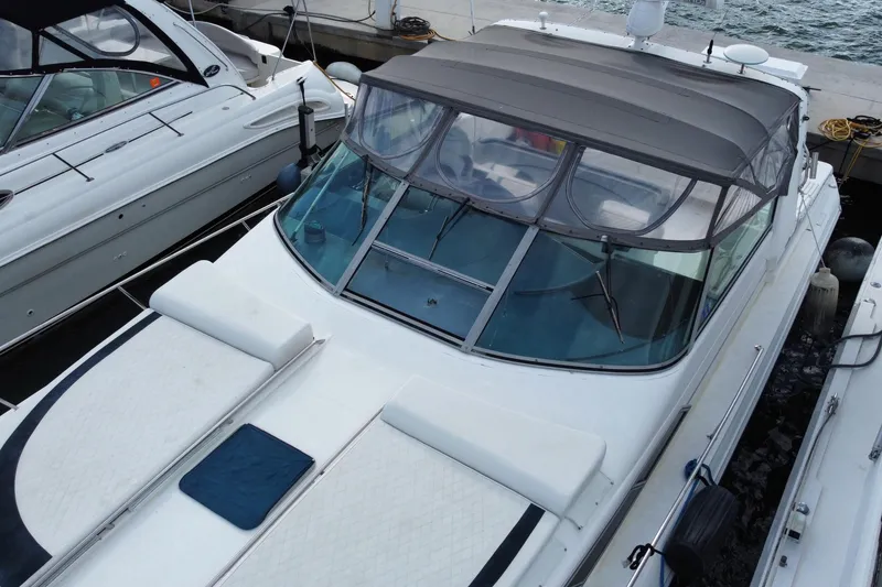 Slide: The Image of 1990 Sea Ray 420 Sundancer yacht docked at marina, aerial view. - 11