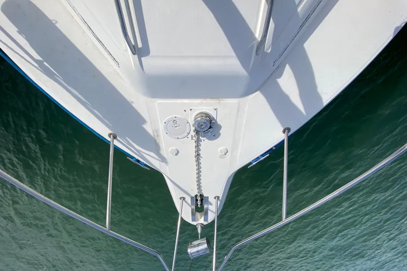 Slide: The Image of Bow view of 1990 Sea Ray 420 Sundancer yacht on water. - 20