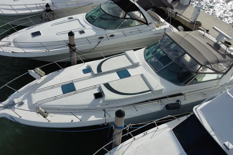 Slide: The Image of 1990 Sea Ray 420 Sundancer yacht docked at marina, aerial view. - 3
