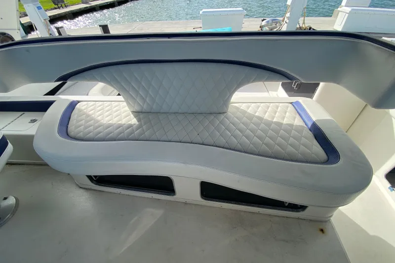 Slide: The Image of Luxurious seating on 1990 Sea Ray 420 Sundancer yacht, dockside view. - 33