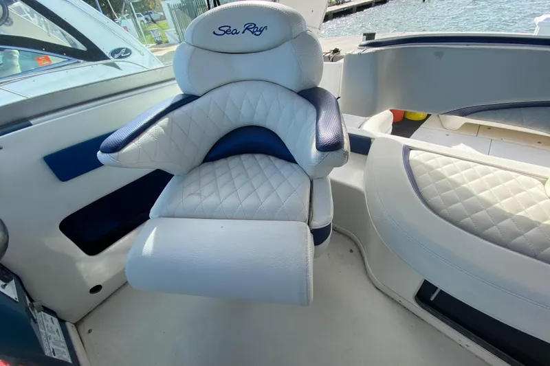 Slide: The Image of Luxurious seating on a 1990 Sea Ray 420 Sundancer boat, featuring quilted upholstery. - 34