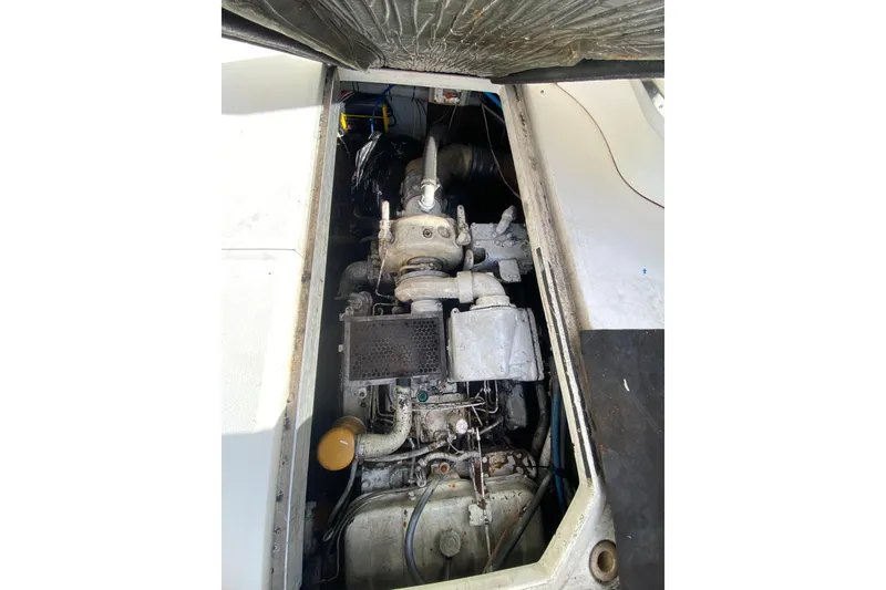 Slide: The Image of Engine compartment of a 1990 Sea Ray 420 Sundancer boat, showing mechanical components. - 51