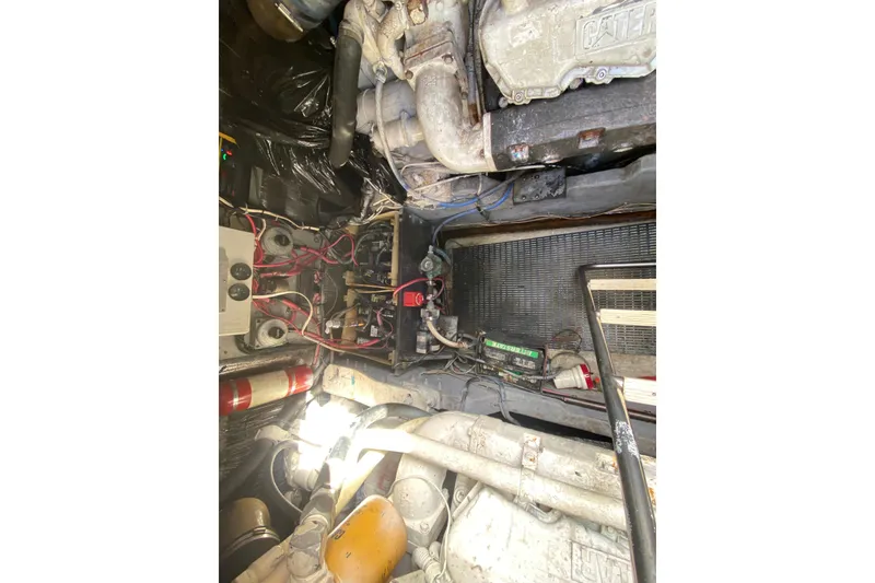 Slide: The Image of Engine room of 1990 Sea Ray 420 Sundancer with visible wiring and components. - 53