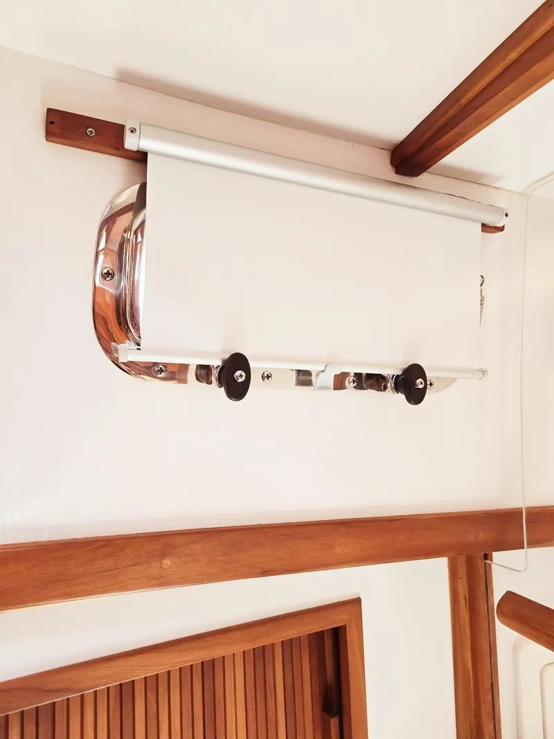 Slide: The Image of Roller blind mechanism on 2004 Sabre 36 Flybridge Fast Trawler, featuring wooden accents. - 31