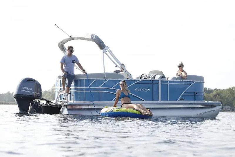 The Image of 2026 Sylvan Mirage 820 Cruise pontoon boat in a showroom setting. - 0