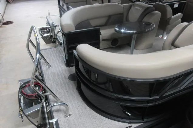 Slide: The Image of 2026 Sylvan Mirage Cruise 822 LZ pontoon boat interior with plush seating and sleek design. - 13