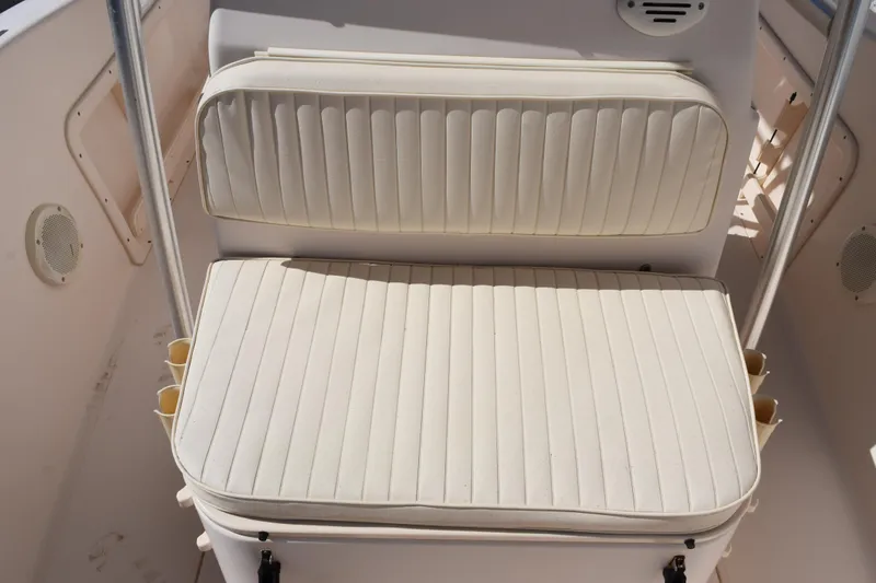 Slide: The Image of Grady-White Fisherman 209 boat seat, 2010 model, featuring white cushioned upholstery. - 12
